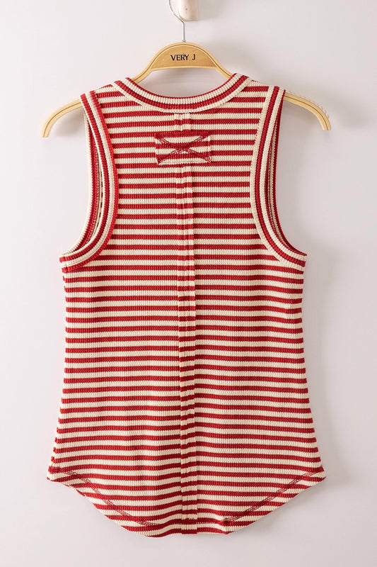 Red and white striped tank top on a wooden hanger against a white background