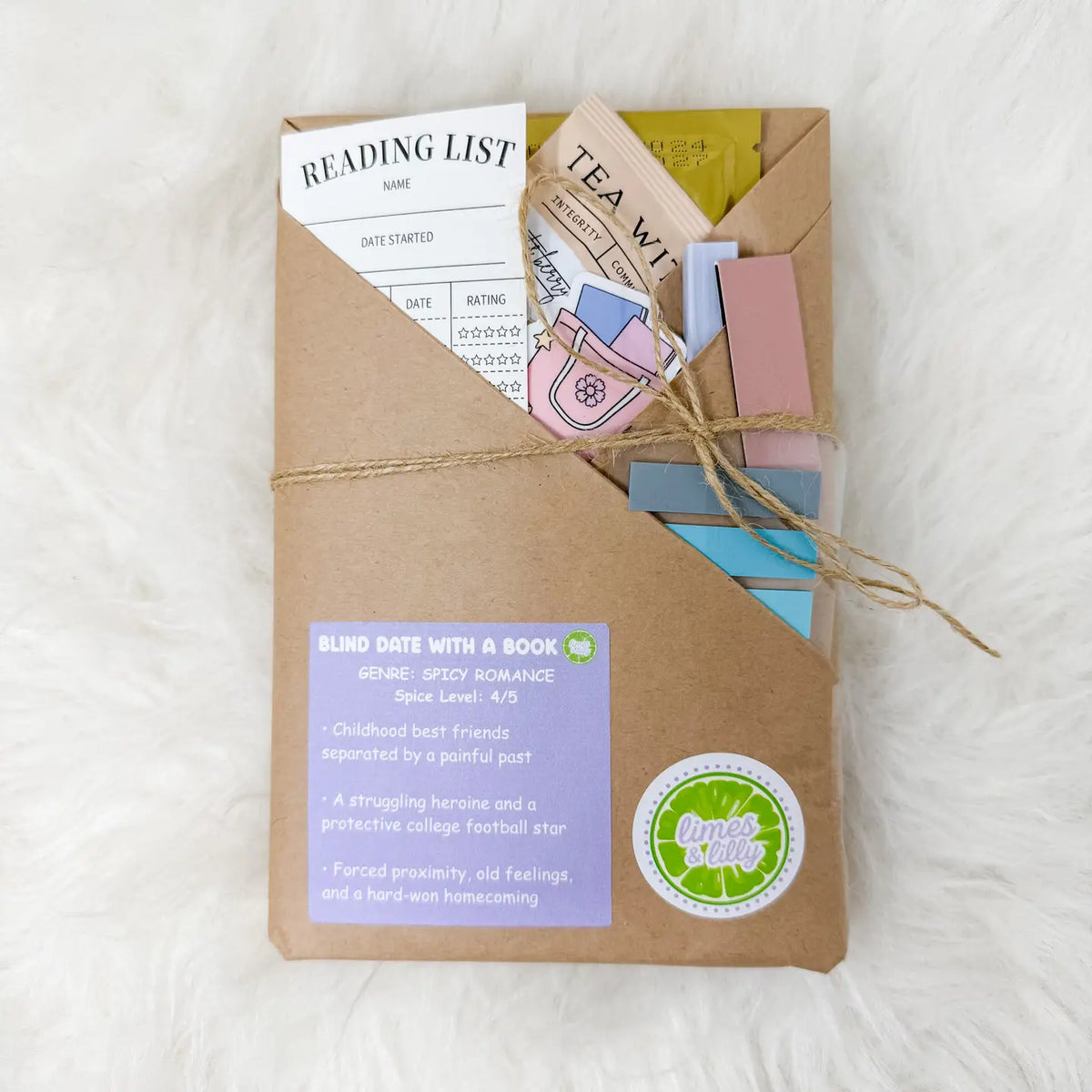 A brown kraft paper blind date with a book package tied with twine, shown on a white faux fur background. The package contains a reading list card, a tea mix packet, colorful bookmark-like strips, and a purple label that reads 'Blind Date with a Book' and 'Quick Reads'.